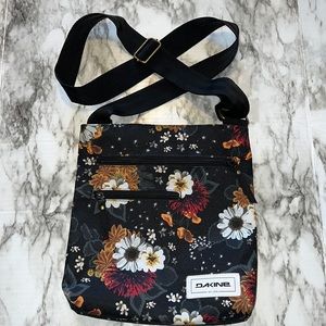 Dakine crossbody purse with flowers.